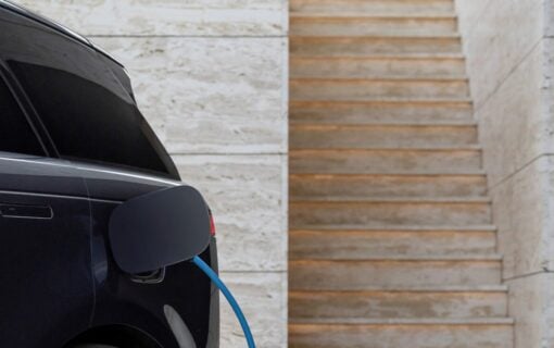 a close up of an ev plugged into a charger