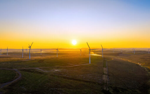 the kype muir onshore wind farm at sunset