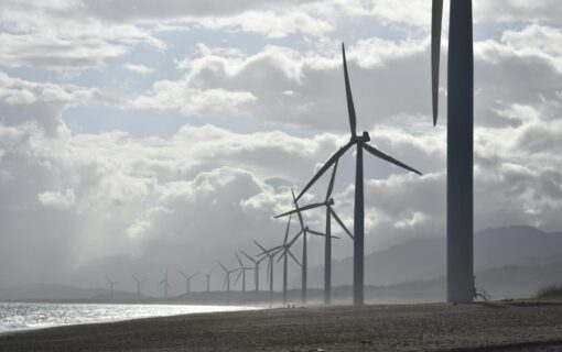 image of wind turbines against a cloudy sky