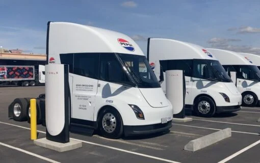 pesico trucks lined up at an ev charger