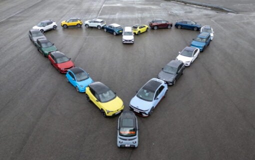 a group of cars parked in the shape of a heart