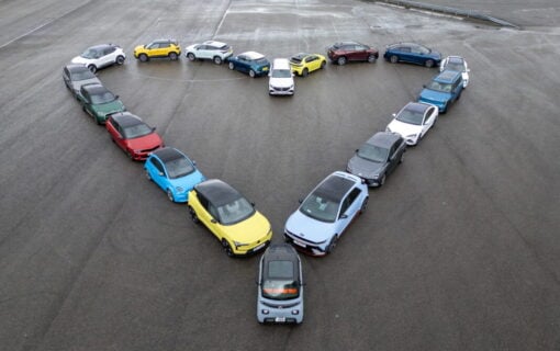 a number of different BEV cars parked in a heart shape