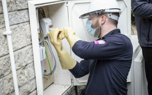 SMS Worker Installing Smart Meter