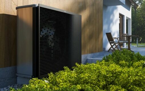 A Daikin heat pump installed against a wooden wall