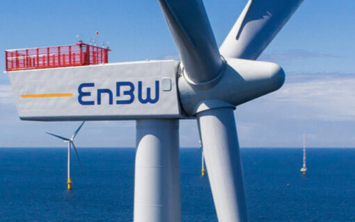 a close up of a wind turbine with the EnBW logo