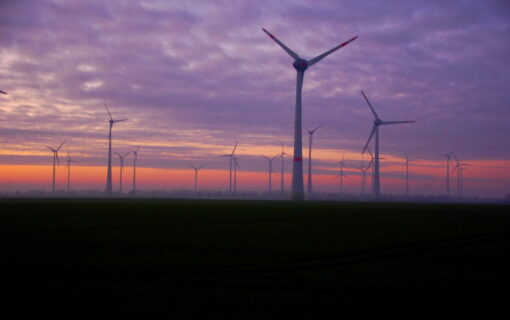 Wind turbines at night.