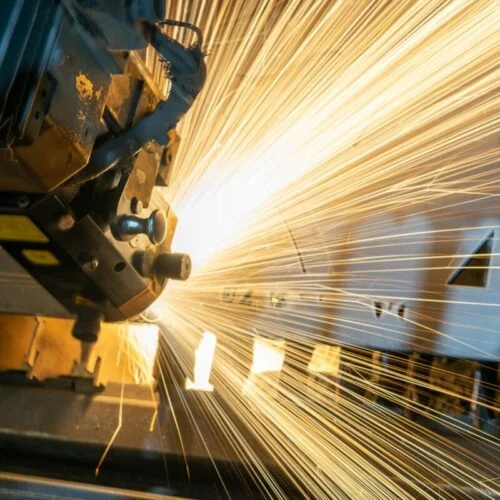 large yellow-white sparks fly off an angle grinder