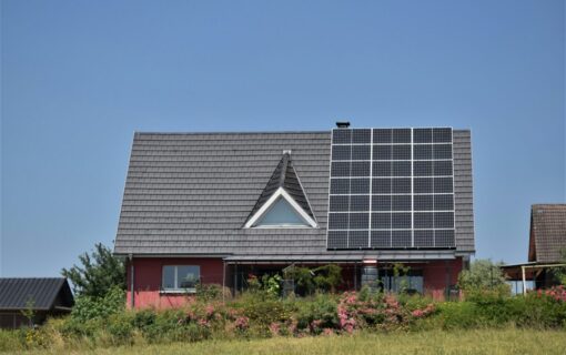 a single house with solar panels on the roof