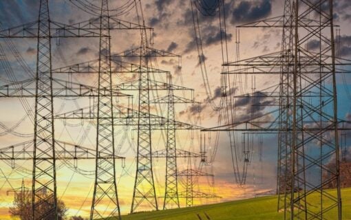 transmission towers at sunset