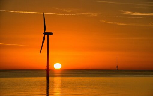 a wind farm at sunset