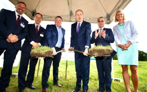 Irish Taoiseach Micheal Martin joins in with the ceremonial start of construction.