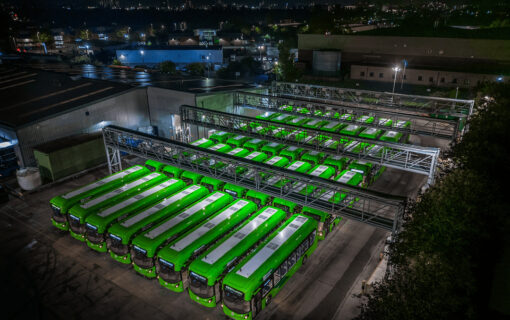 An overhead shot of a bus depot at night