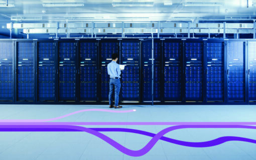 In the Modern Data Center: IT Engineer Standing Beside Open Server Rack Cabinets, Does Wireless Maintenance and Diagnostics Procedure with a Laptop.