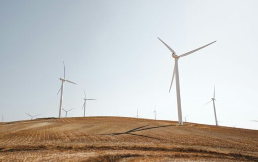 Wind turbines on a dusty hill