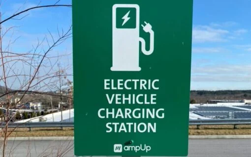 a green sign for an ev charging station