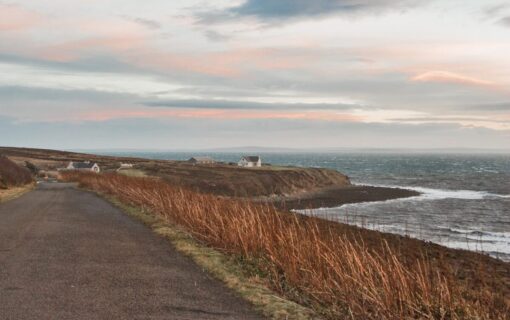 A windswept scottish island at sunset