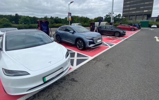 electric cars in a car park lined up