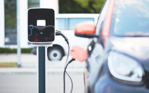An electric car plugged into a chargepoint