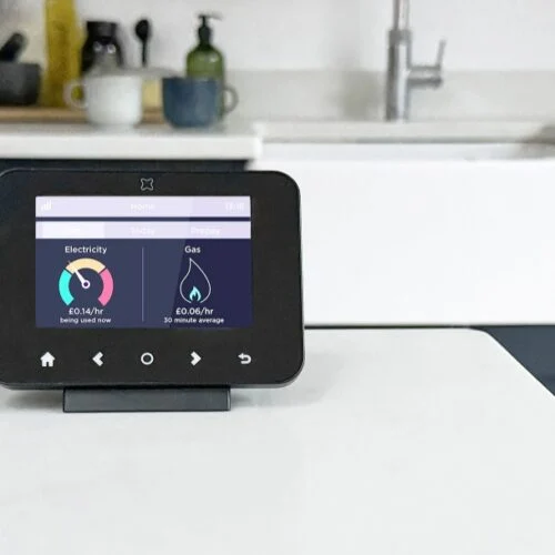 a smart meter sits on a kitchen counter