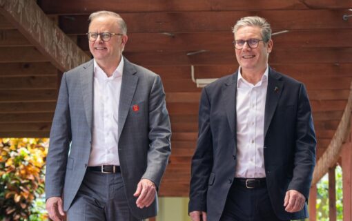 L-R: Anthony Albanese and Keir Starmer walk next to eachother