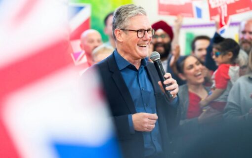Keir Starmer smiling in a crowd on his election campaign.