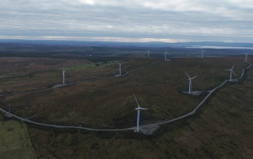 an overhead shot of an onshore wind farm
